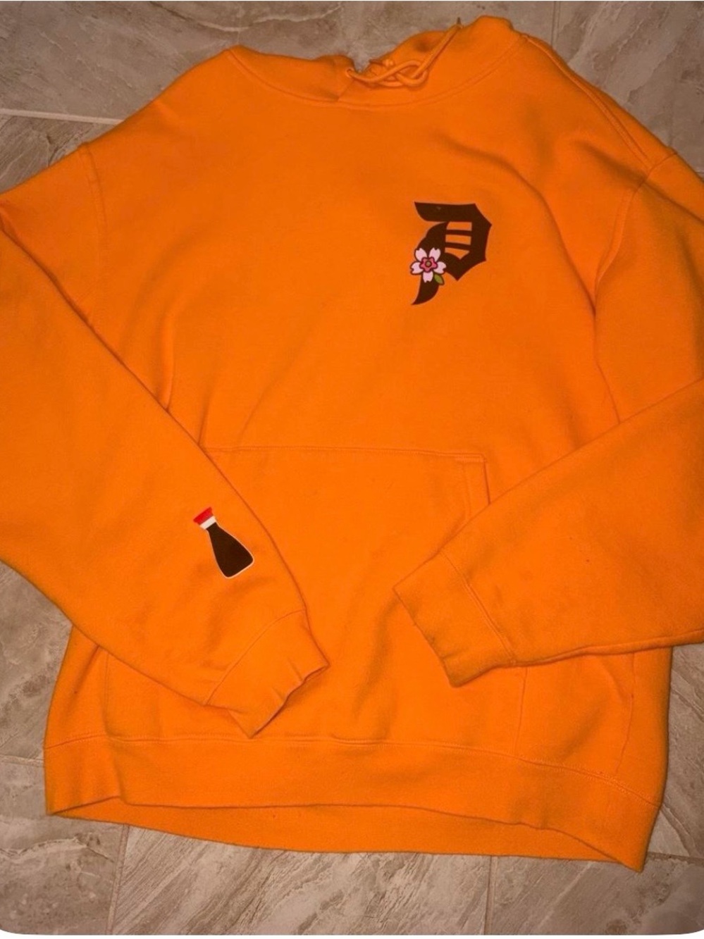 Primitive Orange Hoodie with Small Chest & Sleeve Graphics